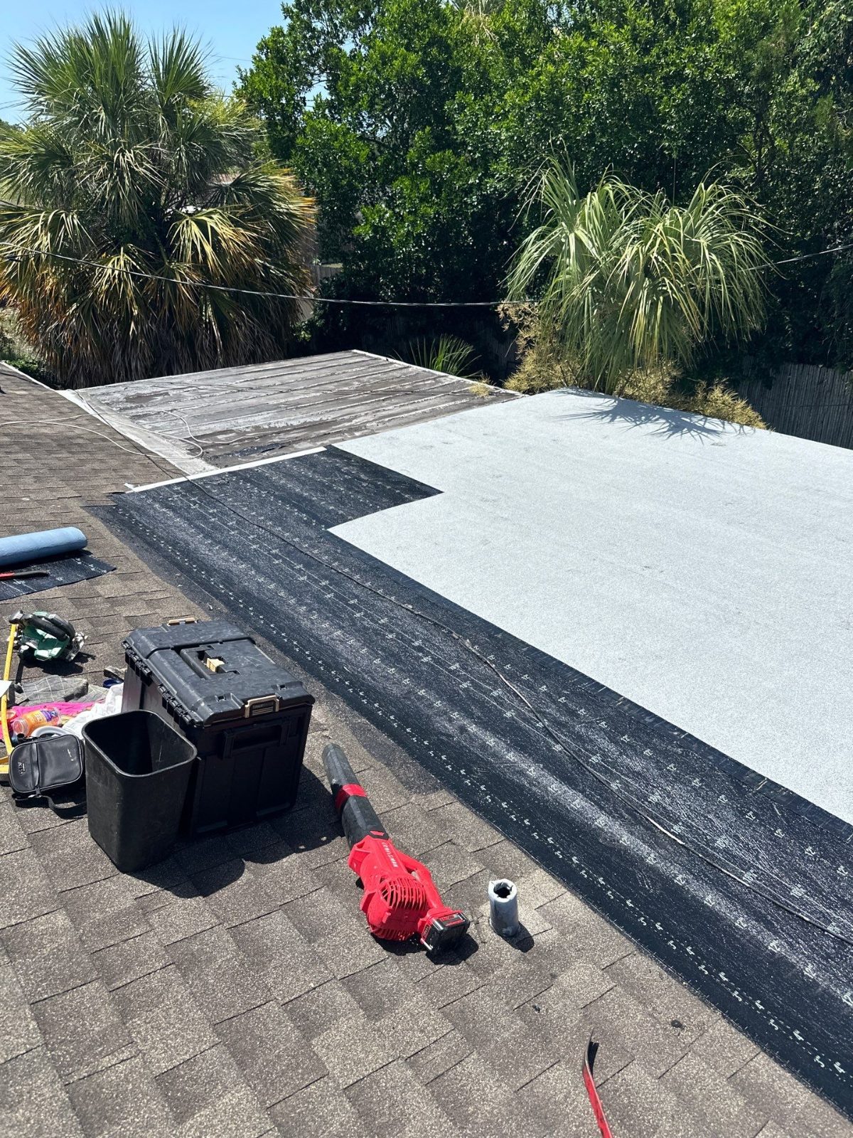 New base sheet and white cap sheet on a low-slope roof in Holiday FL