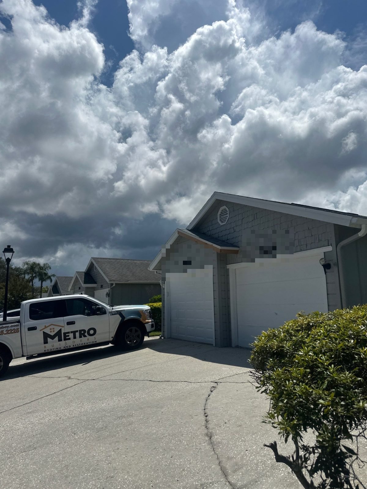 Metro Builders truck at a completed roof replacement in Palm Harbor FL