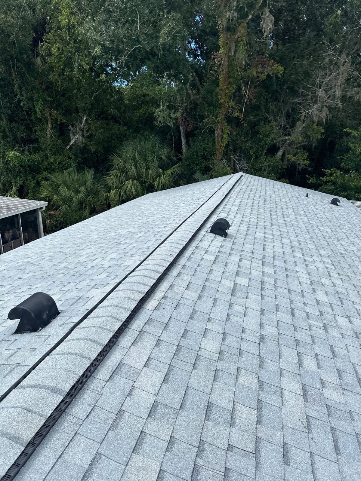 Finished shingle roof ridge and vents in New Port Richey FL